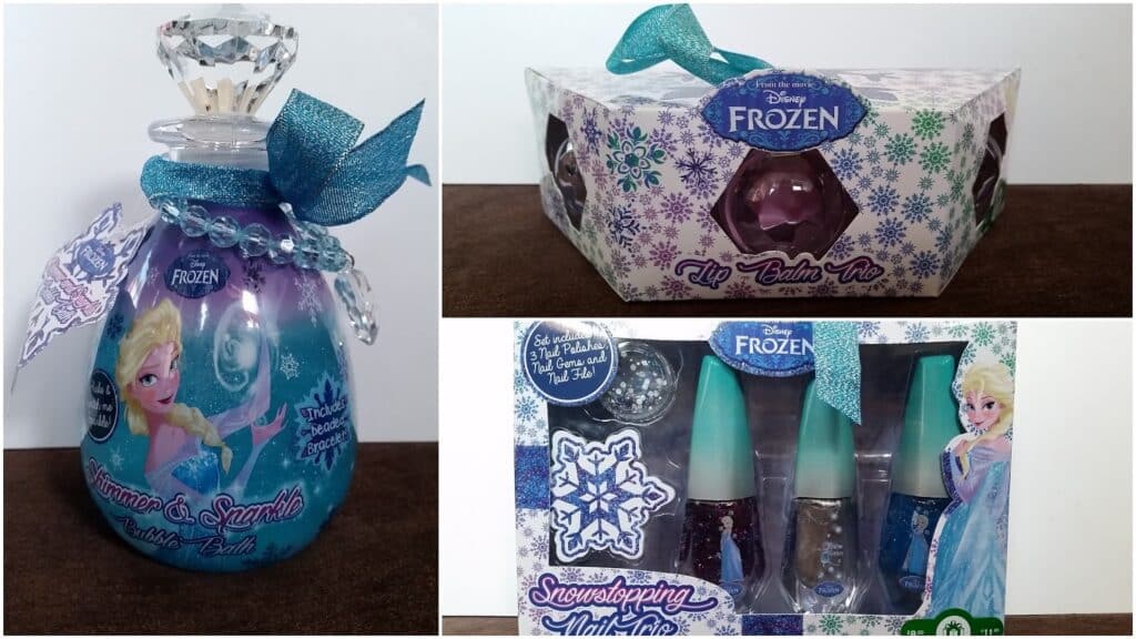 A collage of three Disney Frozen-themed beauty products: a purple bubble bath bottle with Elsa, a snowflake-decorated lip balm in a box, and a "Showstopping Mani Set" with nail polishes and an Elsa illustration on the packaging.