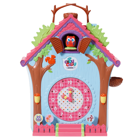 A colourful toy clock shaped like a house, decorated with trees, leaves, and an owl. The clock face is pink with numbers and two moving hands. An owl pops out of a window above, and a small squirrel and acorns add playful details.