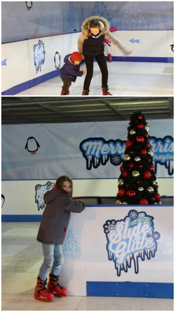 Two photos: Top, a woman helps a small child in red gloves ice skate; both wear jackets and ice skates. Bottom, an older child in a grey coat and red skates stands by the rink barrier near a decorated Christmas tree and festive signs.