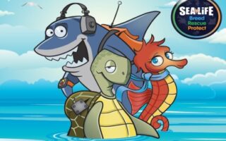 A cartoon shark with headphones, a turtle wearing a rucksack, and a seahorse with a scarf are together in the sea. The sky is blue with a few clouds. In the top right corner is a SEA LIFE badge with the words "Breed Rescue Protect.