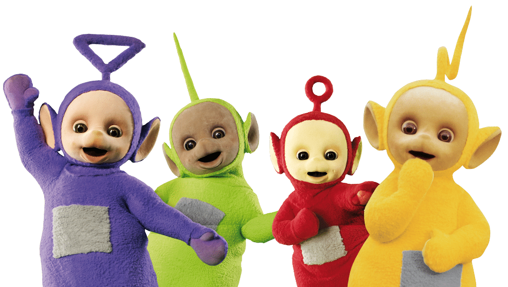 Four colourful Teletubbies—Tinky Winky (purple), Dipsy (green), Laa-Laa (yellow), and Po (red)—stand together smiling against a white background. Each has a grey square on their belly and unique aerials on their heads.