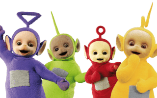 Four colourful Teletubbies—Tinky Winky (purple), Dipsy (green), Laa-Laa (yellow), and Po (red)—stand together smiling against a white background. Each has a grey square on their belly and unique aerials on their heads.