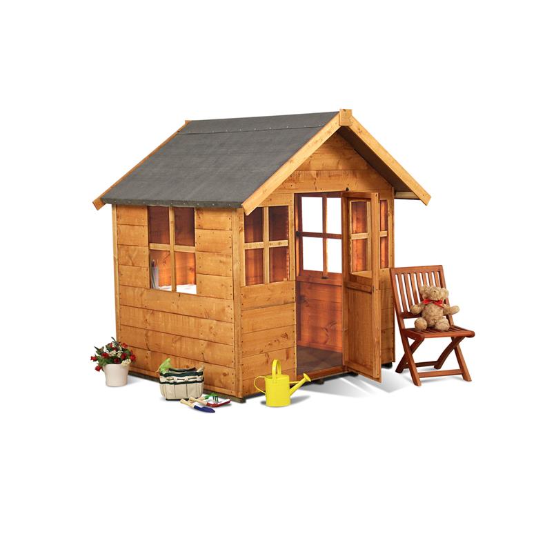 A small wooden playhouse with windows and an open door sits on a white background. Nearby are a wooden chair with a teddy bear, a yellow watering can, toy gardening tools, potted flowers, and a basket, suggesting a playful, garden-themed setting.