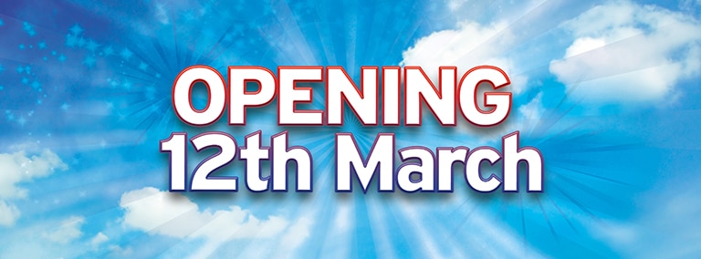 Text reading "OPENING 12th March" in large, bold letters is centred against a background of a bright blue sky with white clouds and light rays radiating outward, creating a sense of excitement and anticipation.