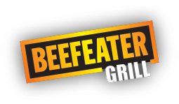 Logo with the word "BEEFEATER" in bold yellow uppercase letters, outlined in black and orange, above the word "GRILL" in smaller white uppercase letters. The text is slanted diagonally on a white background with a light shadow effect.