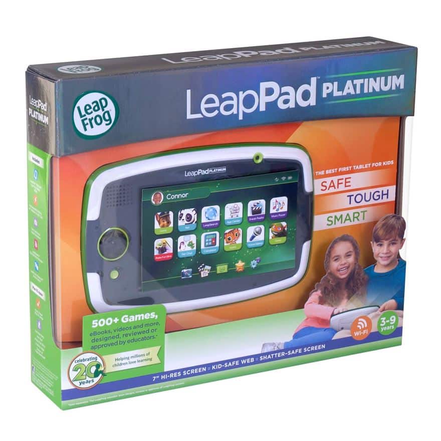 A LeapFrog LeapPad Platinum tablet in its box. The box is green and purple, showing the tablet screen with children’s apps. Text highlights features like "Safe," "Tough," "Smart," for ages 3–9, and advertises 500+ games, WiFi, and a 7-inch hi-res screen.