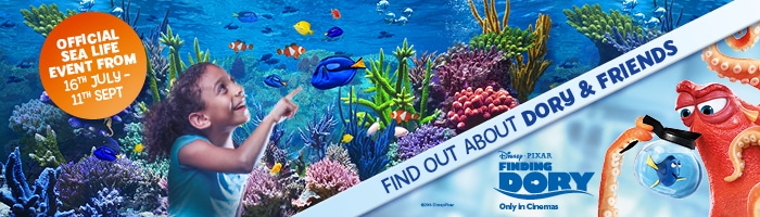 A young girl smiles and points at colourful fish in a vibrant coral reef scene. Disney Pixar’s Dory swims nearby. Text reads “Official SEA LIFE Event 16th Jul–11th Sept” and “Find out about Dory & Friends—Finding Dory Only in Cinemas.” Hank the octopus is also shown.