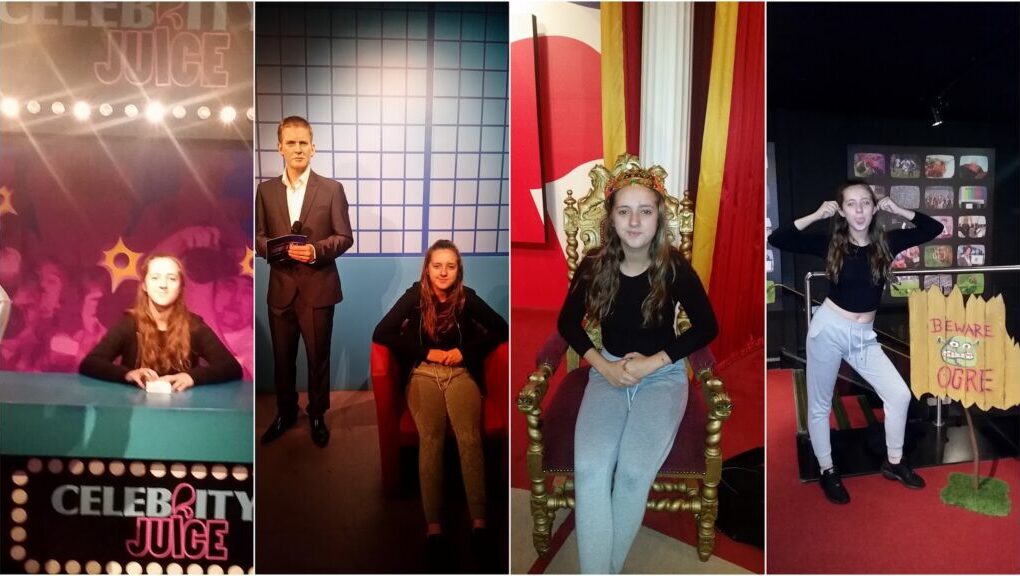 A girl with long brown hair, wearing a black top and grey trousers, poses in four different scenes: behind a "Celebrity Juice" desk, beside a male wax figure, sitting on a golden throne, and standing near a “Beware Ogre” sign, making a playful gesture.