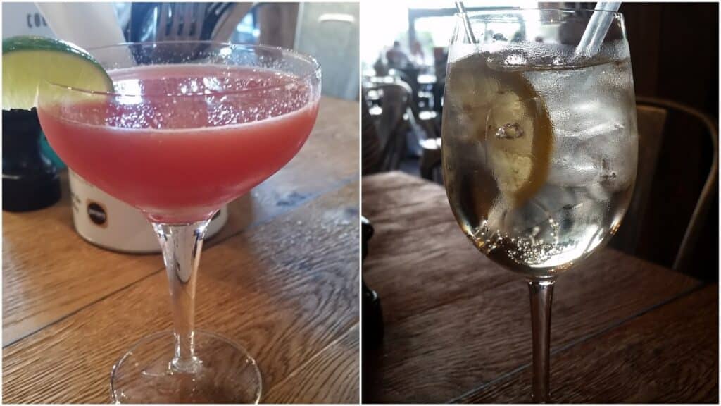 A split image shows two cocktails on a wooden table: the left glass holds a pink drink with a lime wedge; the right glass contains a clear, fizzy drink with ice and a lemon slice. Backgrounds feature blurred restaurant settings.