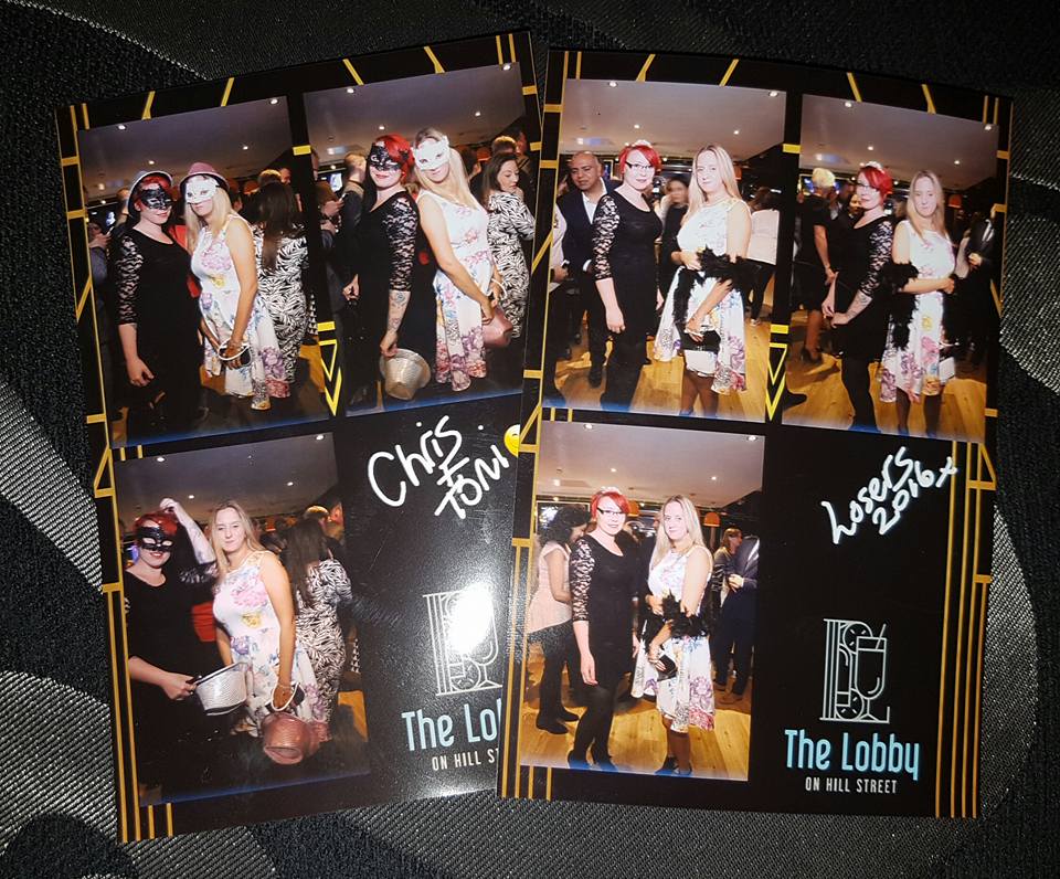 Six women in fancy dress and party outfits pose together in two collage-style photo prints, taken at "The Lobby on Hill Street." The photos show group and individual shots, with playful handwritten text: "Chris Town" and "Losers 2014" on the images.