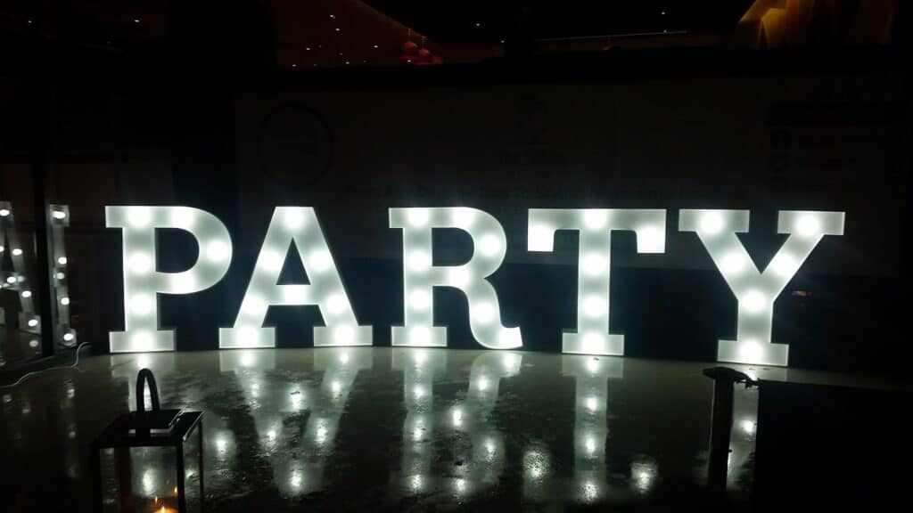 A lit up letters in a dark room.