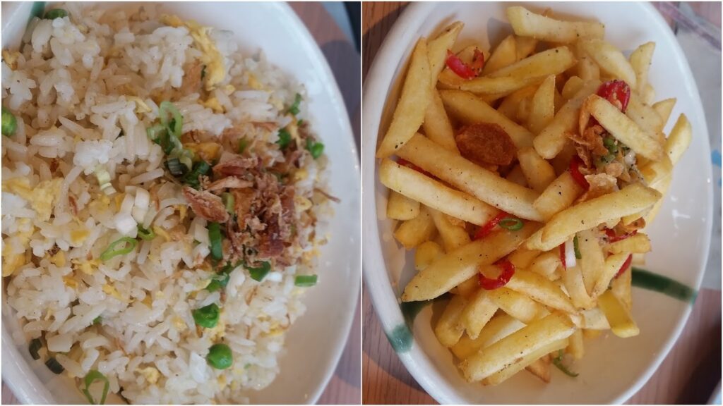 A split image shows two dishes: on the left, fried rice with egg, green peas, chopped spring onions, and crispy shallots; on the right, seasoned chips garnished with fried shallots, sliced chilli, and chopped spring onions, both served in white bowls.
