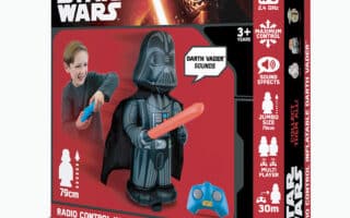The image shows a Star Wars toy box featuring a remote control inflatable Darth Vader. A smiling boy plays with the toy using a blue remote. The box highlights features: Darth Vader sounds, jumbo size (79cm), 30m range, and 2.4 GHz control.