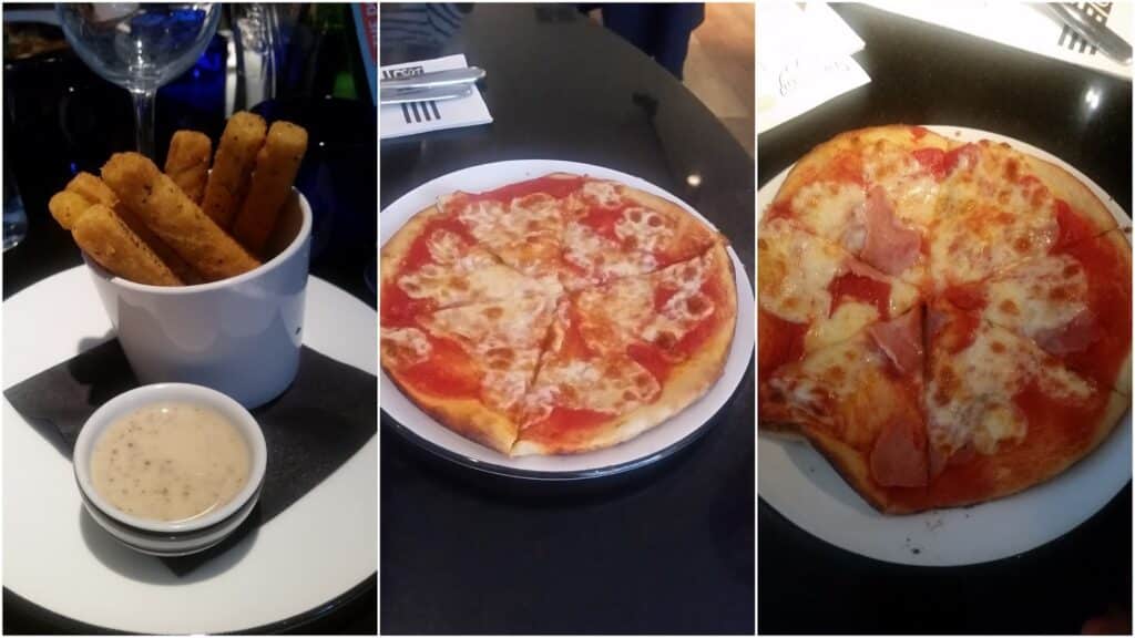 Three-panel image: Left, a cup with golden mozzarella sticks and a dish of creamy dip. Centre, a round cheese pizza with tomato sauce on a white plate. Right, a similar pizza, partially sliced, with ham pieces on top. All items are on a dark table.