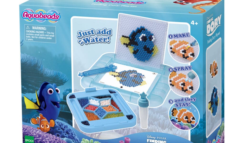 A box of Aquabeads Finding Dory Playset features Dory, Nemo, and other sea creatures made from colourful water-fused beads. The packaging shows finished bead designs, included tools, and the slogan “Just add water!” with images of the characters underwater.