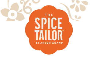 An orange, flower-shaped logo features "The Spice Tailor by Anjum Anand" in white, bold letters. Beige floral patterns decorate the top left and right corners, set against a light background.