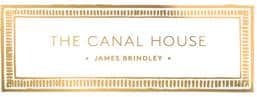 A rectangular gold-bordered sign with the text "THE CANAL HOUSE" in capital letters. Below, in smaller letters, it says "JAMES BRINDLEY." The background is white, and the overall design is elegant and minimalistic.