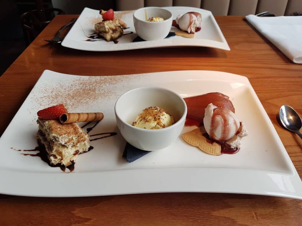 A plate of puddings on a table.