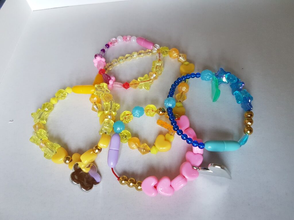 A group of colourful bracelets.