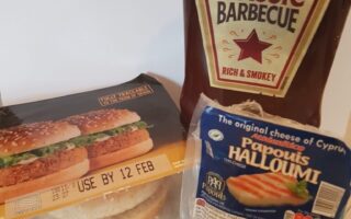 A bag of burgers and a bag of sauce.