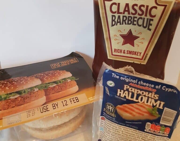 A bag of burgers and a bag of sauce.