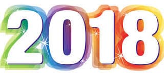 The image shows the number "2018" in bold white text with a blue outline, set against a vibrant, multicoloured background with shades of green, pink, orange, purple, and blue. Sparkling stars accent the colourful backdrop.