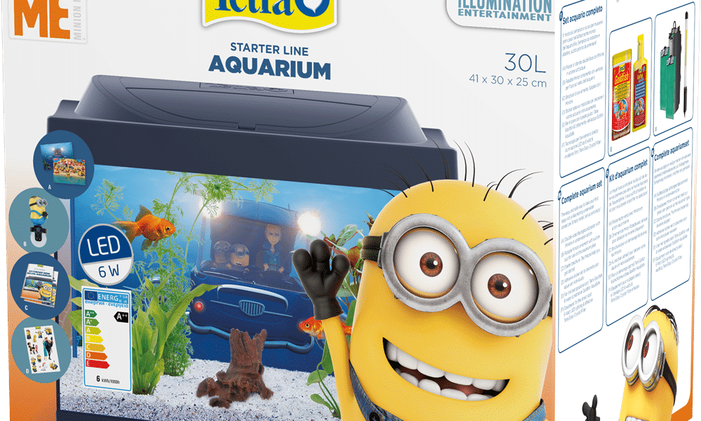A colourful box displays a Tetra Starter Line Aquarium kit featuring a 30L tank decorated with Minions from Despicable Me. A smiling Minion waves beside the tank. The packaging highlights LED lighting, included accessories, and animated aquarium graphics.