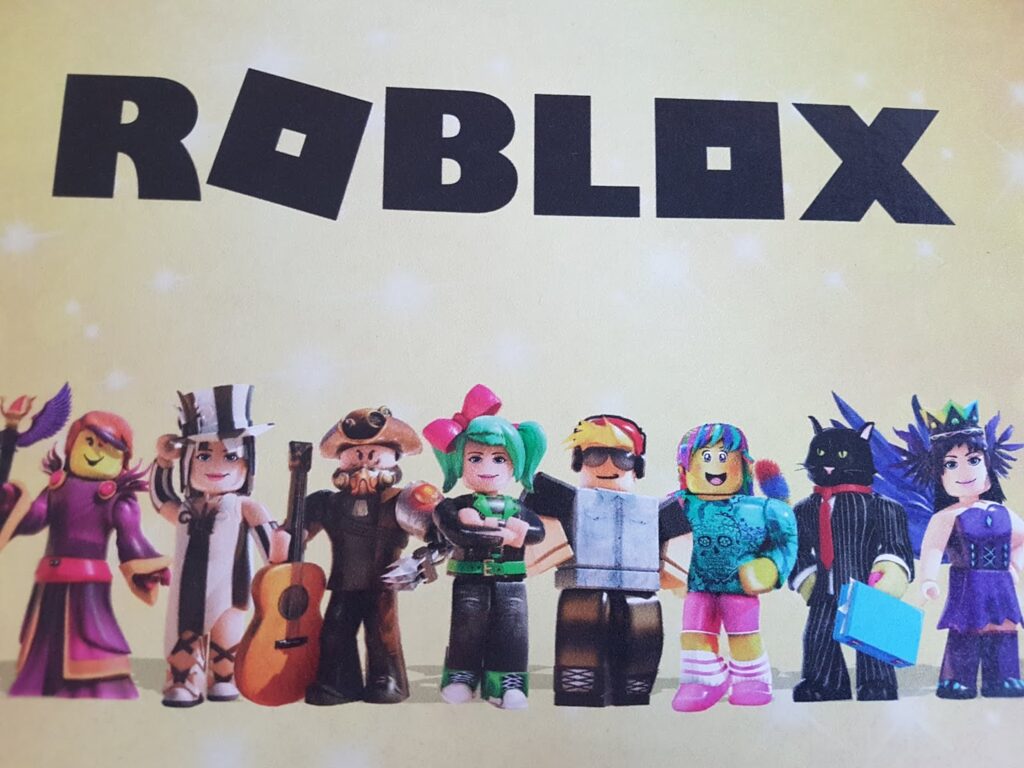 A group of eight colourful Roblox characters stand in a row under the bold, black "ROBLOX" logo on a yellow background. Each character is uniquely dressed, featuring various costumes, accessories, and hairstyles, representing different Roblox avatars.