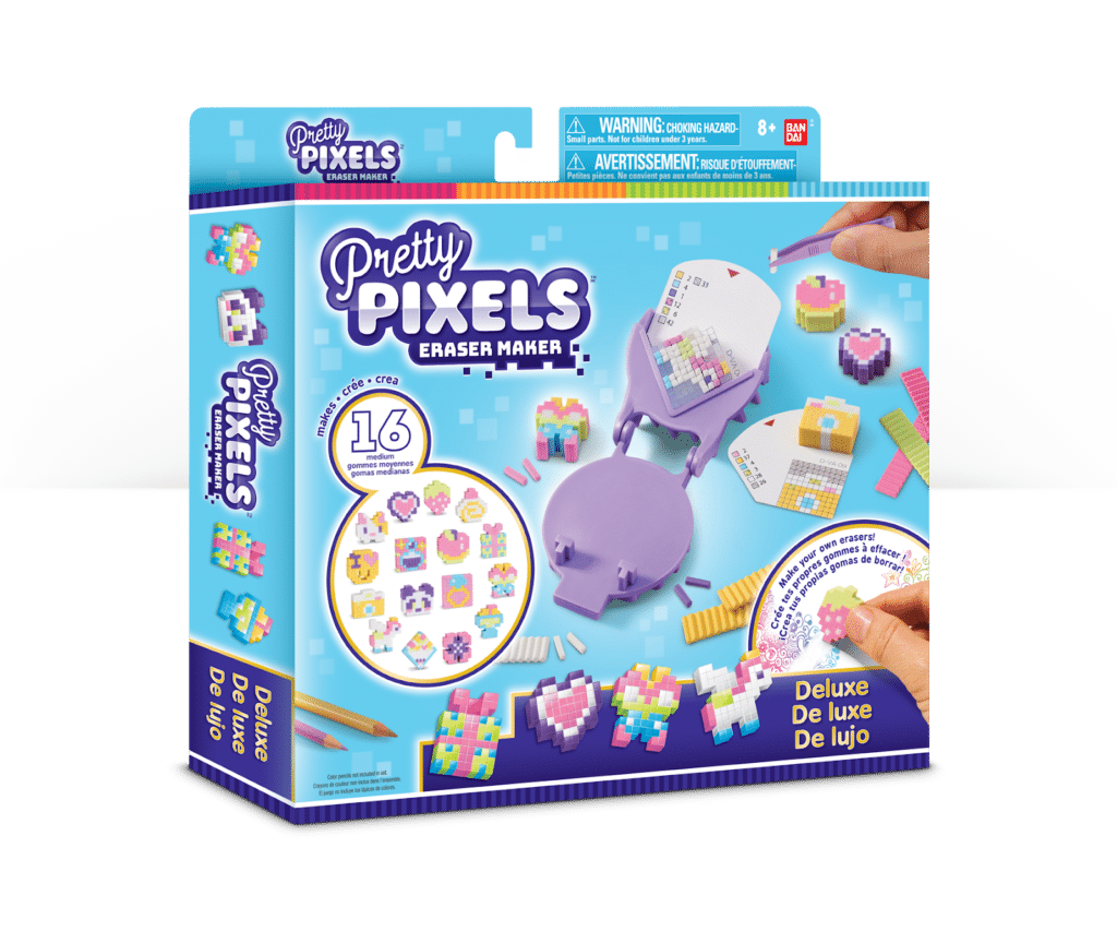Front view of a "Pretty Pixels Eraser Maker" deluxe kit box. The box is mostly blue and purple, showing colourful pixel-style erasers, tools, and hands assembling erasers. Includes 16 designs, with text in English, Spanish, and French.