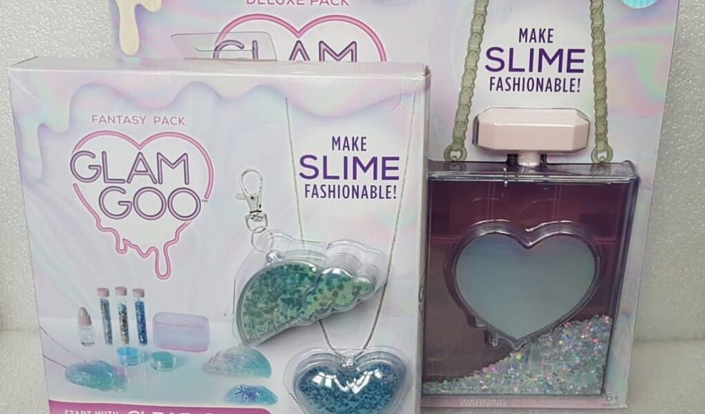 A box with a bottle and a necklace.