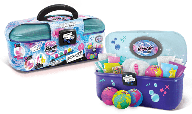 A blue and purple bath bomb kit with a black handle is shown open and closed. Inside are colourful bath bomb moulds, packets, and tools. In front, two finished globe-shaped bath bombs are displayed on a white surface. The kit is labelled “So Bomb DIY.”.