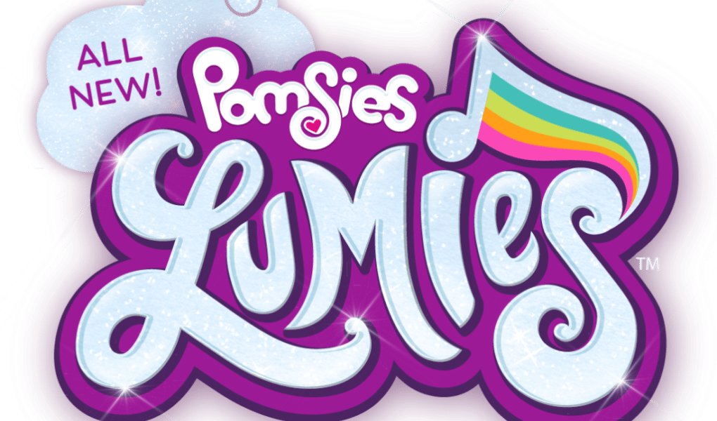 A colourful logo with the words “ALL NEW! Pomsies Lumies.” "Lumies" is written in sparkling, light blue letters outlined in purple, with a rainbow-striped musical note above the “i.” A white cloud shape highlights the phrase “ALL NEW!”.