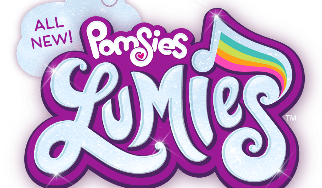 A colourful logo with the words “ALL NEW! Pomsies Lumies.” "Lumies" is written in sparkling, light blue letters outlined in purple, with a rainbow-striped musical note above the “i.” A white cloud shape highlights the phrase “ALL NEW!”.