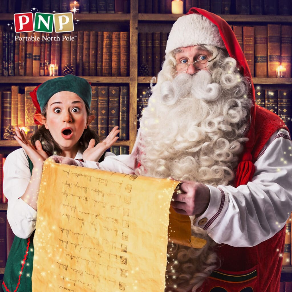 Father Christmas, holding a large glowing scroll, stands beside a surprised elf in a festive outfit. Both are in front of bookshelves filled with old books. The PNP (Portable North Pole) logo appears in the top left corner. Magic sparkles decorate the scene.