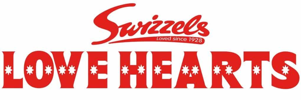 The image features the red "Swizzels" logo with the slogan "Loved since 1928" above bold red text reading "LOVE HEARTS." Each letter "O" in "LOVE" and "HEARTS" contains a white heart shape in the centre. The background is white.